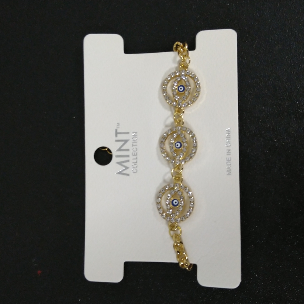 Mint Collection Gold and silver rhinestone w circular blue evil eye bracelet